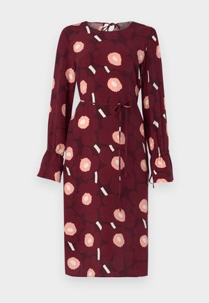 Long-sleeve burgundy dress with pink floral pattern, tie waist, and ruffled cuffs. Round neckline with a keyhole back detail and contrasting stripes.