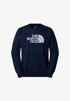 Navyblauwe sweatshirt met een geribbelde ronde hals, lange mouwen en een wit logo op de voorkant. Gemaakt van zachte, gestructureerde stof.
