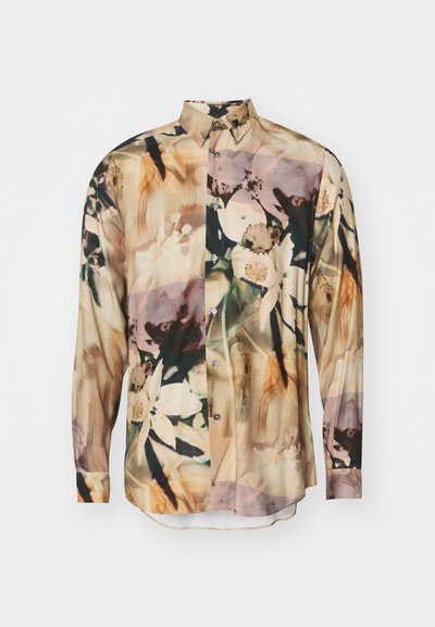 Garā piedurkņu krekls no caurspīdīgas auduma ar ziedu rakstu bālās krāsās. Tam ir pogas uz apkakles un priekšpusē, ar izliekto apakšdaļu.