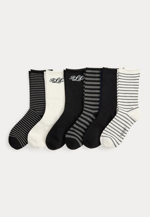 Sešas zeķu pārus no kokvilnas melnās, baltās un svītrainās krāsās, ar ribotām maliņām un diskretu logo izšuvumu uz izvēlētajiem pāriem.