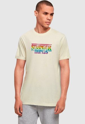 STRANGER THINGS - RAINBOW DOT LOGO - Print T-shirt - sand