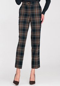 Spodnie w kratę w ciemnozielonym, brązowym i kremowym kolorze z wysokim stanem, posiadające zapięcie na guzik i dopasowany krój. Gładka tekstura.