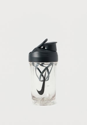 Clear plastic shaker bottle with a black, curved lid. Features a prominent Nike logo and measurement markers on the side.