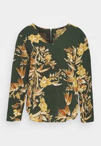 Top a maniche lunghe in tessuto verde scuro con un motivo floreale in tonalità gialle e marroni. Presenta un scollatura a V e un dettaglio con zip sul retro.