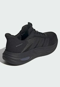 Black athletic shoe featuring a mesh upper, textured side accents, padded collar, and a thick sole labeled "CLOUDFOAM."