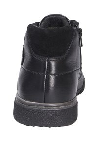 Black leather ankle boot with a suede top trim, side zipper, textured rubber sole, and stitched detailing for enhanced design.