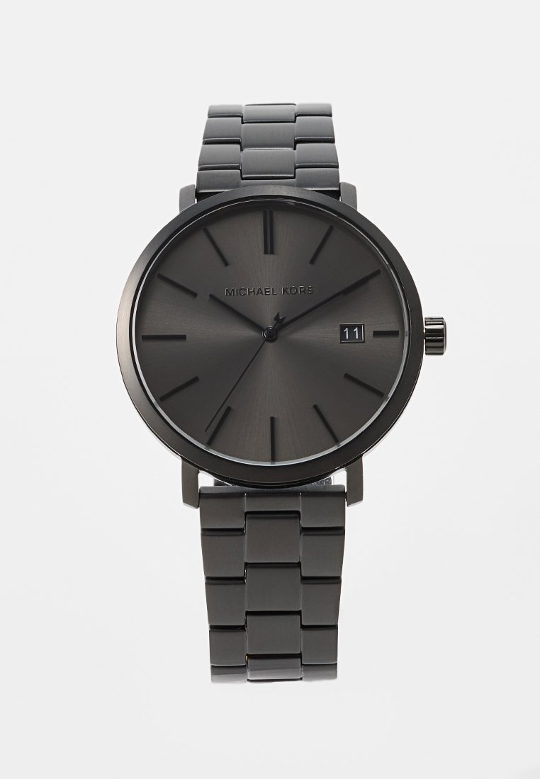 Montre en acier inoxydable noir avec un design minimaliste, dotée d'un cadran rond, d'un cadran gris, de marqueurs d'heure en gras, d'une fenêtre de date et d'un bracelet à maillons.