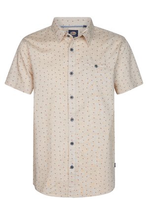 Camicia a maniche corte con bottoni realizzata in tessuto leggero. Sfondo crema con un piccolo motivo a pois multicolori. Presenta una tasca sul petto e bottoni blu.