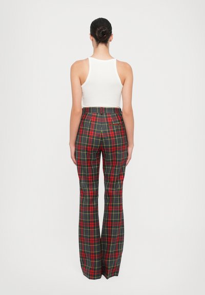 Plaid flared trousers feature a red, green, and yellow pattern, high waist, and a back pocket. Made from a smooth fabric with a structured fit.