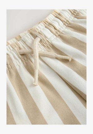 Smėlio spalvos ir baltos spalvos juostuotas audinys su elastinga juosmens juosta ir priekiniame krašte pynu raišteliu. Minkšta tekstūra su neformaliu dizainu.