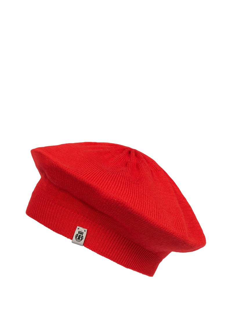 Red knitted beret with a ribbed band and a central top seam. Features a small logo tag on the side. Soft texture and slouchy shape.