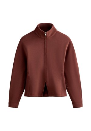 Maroon zip-up jacket with a high collar, featuring a split front design and textured fabric. Long sleeves with ribbed accents.