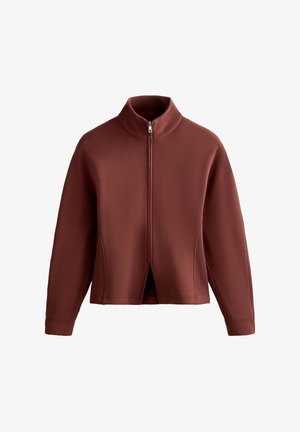 Maroon zip-up jacket with a high collar, featuring a split front design and textured fabric. Long sleeves with ribbed accents.