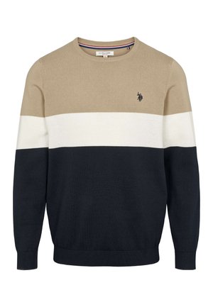 Megztinis su apvalia iškirpte, horizontaliomis juostomis smėlio, kreminės ir tamsiai mėlynos spalvų, su mažu logotipu krūtinės srityje ir banguotomis rankogaliais.