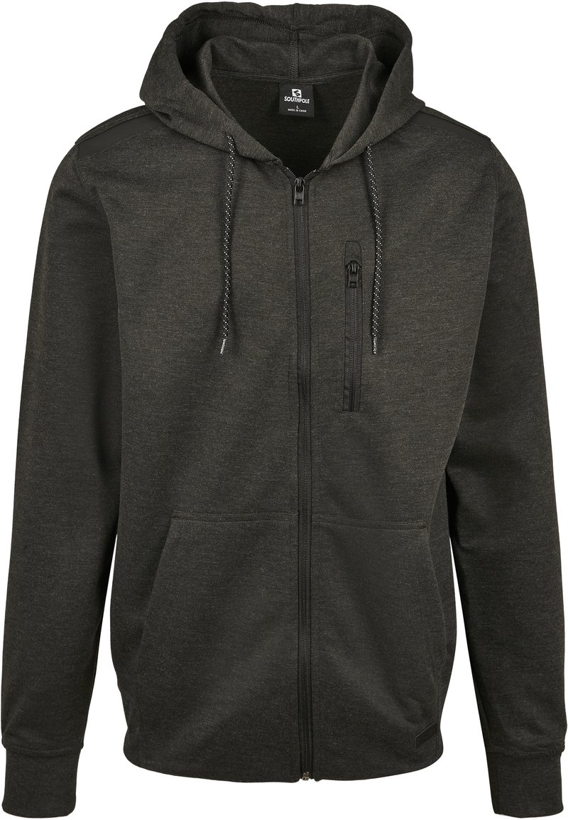 Felpa con zip di colore grigio scuro, con coulisse, tasche davanti a forma di canguro, dettagli sulle spalle e una tasca sul petto con zip verticale.