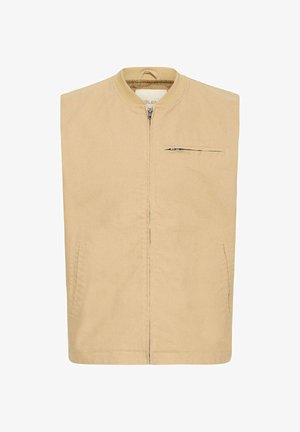 Beige ärmellose Jacke mit Reißverschluss vorne, Stehkragen, zwei Seitentaschen und einer kleinen Reißverschlusstasche auf der Brust.