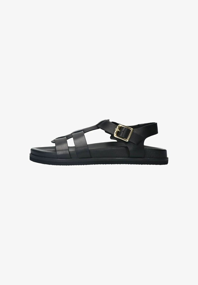 Black sandals made of synthetic material with crisscross straps, adjustable buckle, flat sole, and textured grip. No heel.
