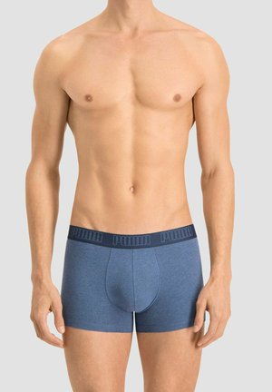 Blue cotton boxer shorts with a navy elastic waistband featuring raised "PUMA" branding. Fitted design, smooth texture, and classic shape.