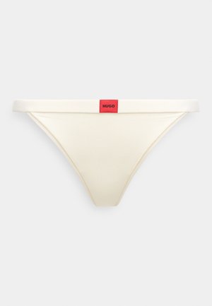 Hugo prekės ženklo kreminės spalvos stringai su minkšta juosmens juostele, kurioje yra raudona logotipo etiketė. Pagaminta iš lygaus audinio su minimaliais siuvimo detalėmis.