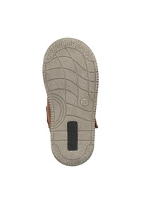 Semelle de chaussure tan avec caoutchouc texturé pour une meilleure adhérence, présentant un motif de crantage et un accent rectangulaire noir au centre. Taille marquée "20."
