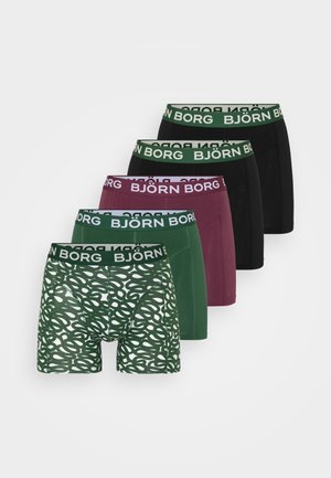 Grønne mønstrede boxer shorts med en bred elastisk talje, der viser "BJÖRN BORG." Designet har sammenflettede løkker i lys og mørkegrøn.