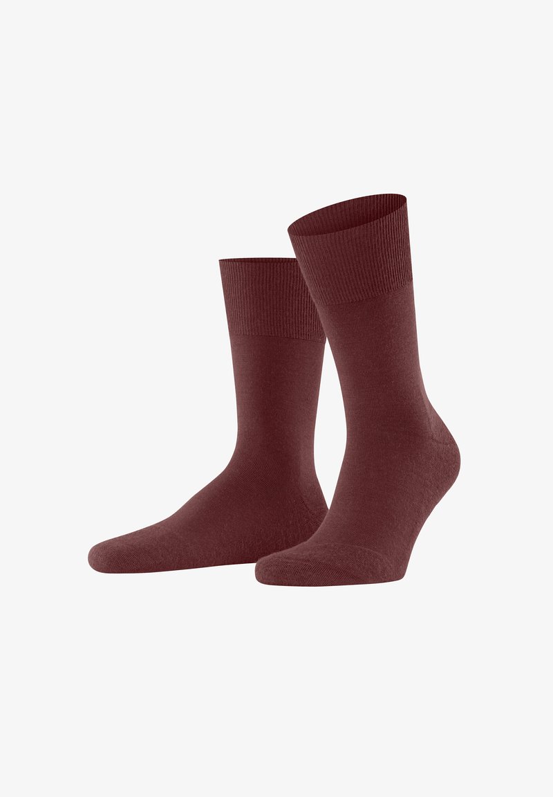 Maroon socks with ribbed cuffs, positioned upright on a white background, showcasing their smooth texture and design.