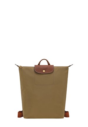Brown rectangular backpack with leather flap and gold button closure, top handle, and adjustable shoulder straps on white background.
