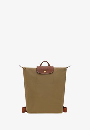 Brown rectangular backpack with leather flap and gold button closure, top handle, and adjustable shoulder straps on white background.