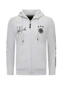 Grijze hoodie met een rits, voorzien van een capuchon, bedrukt met zwarte tekst, een rond logo en drie steraccenten op de borst en mouwen.