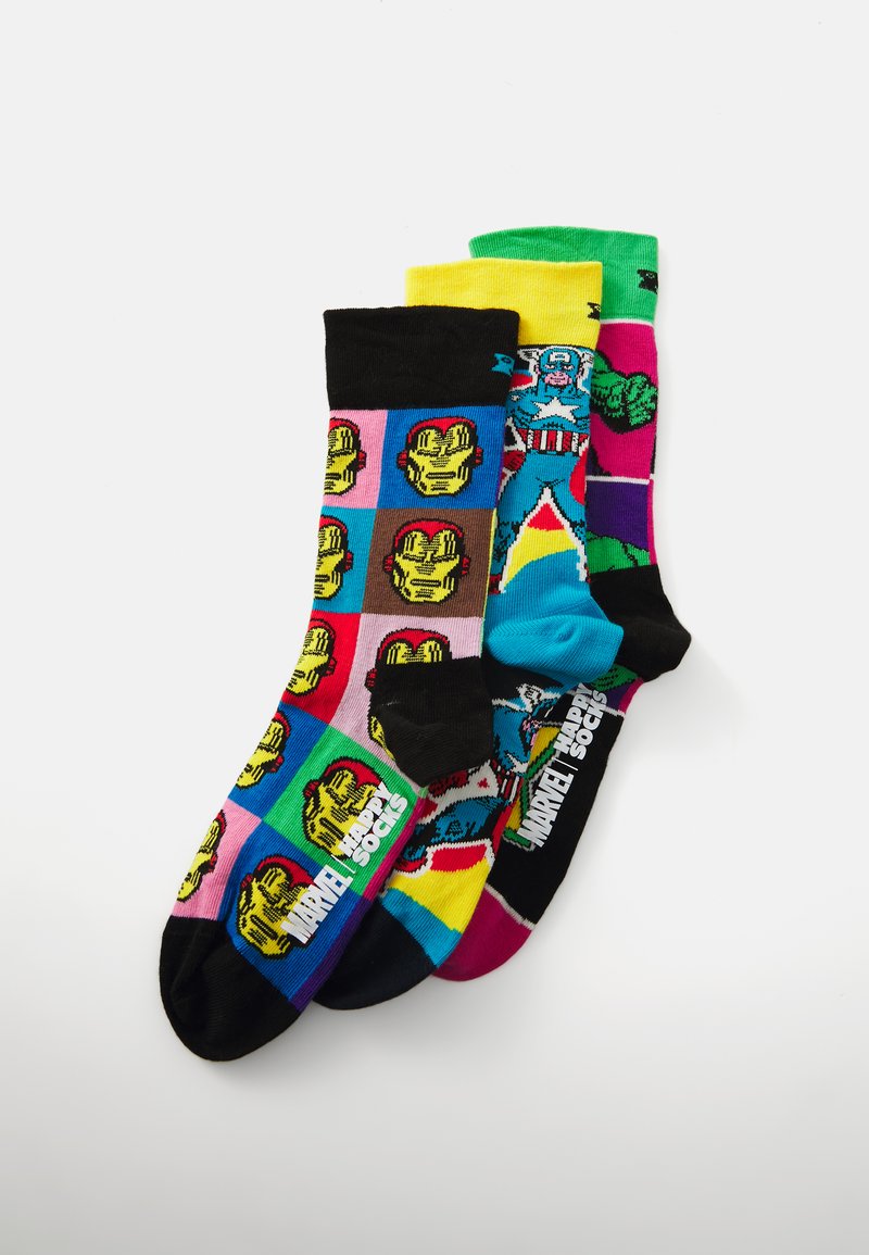 Trois paires de chaussettes colorées présentent des personnages Marvel. Les matériaux sont en mélange de coton. Les motifs incluent des impressions de style bande dessinée dans des teintes variées.