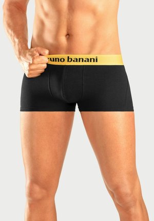 Mustad mustanditega mustad poksi aluspüksid, millel on "bruno banani" logo. Valmistatud pehmest kangast, sobiv disain ja vastupidavad õmblused.
