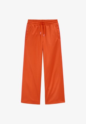 Laza, narancssárga melegítőnadrág elasztikus derékpánttal, húzózsinórral, oldalzsebekkel és kontrasztos rózsaszín csíkokkal a külső varrás mentén.