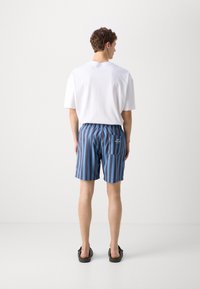 Mads Nørgaard SEA PRINT - Kopalne hlače - deep well/captains blue