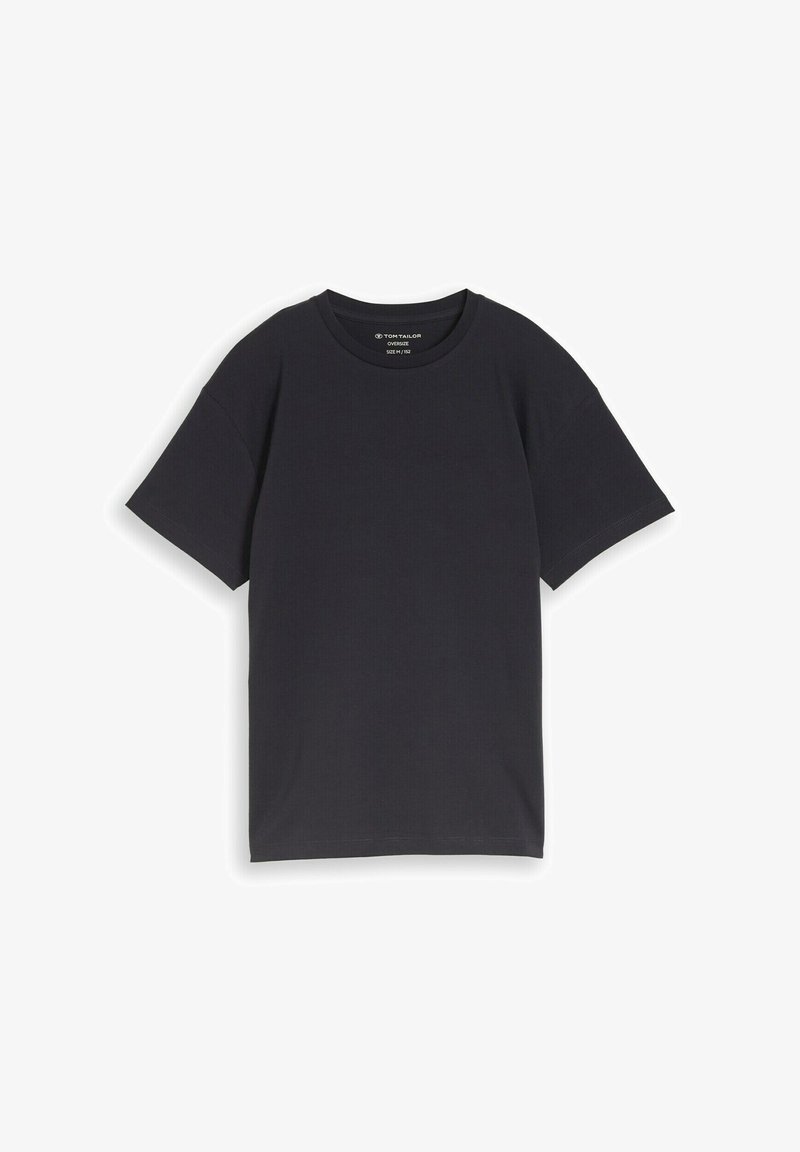 T-shirt noir surdimensionné à manches courtes et col rond, posé à plat avec l'étiquette de la marque visible à l'intérieur du col.