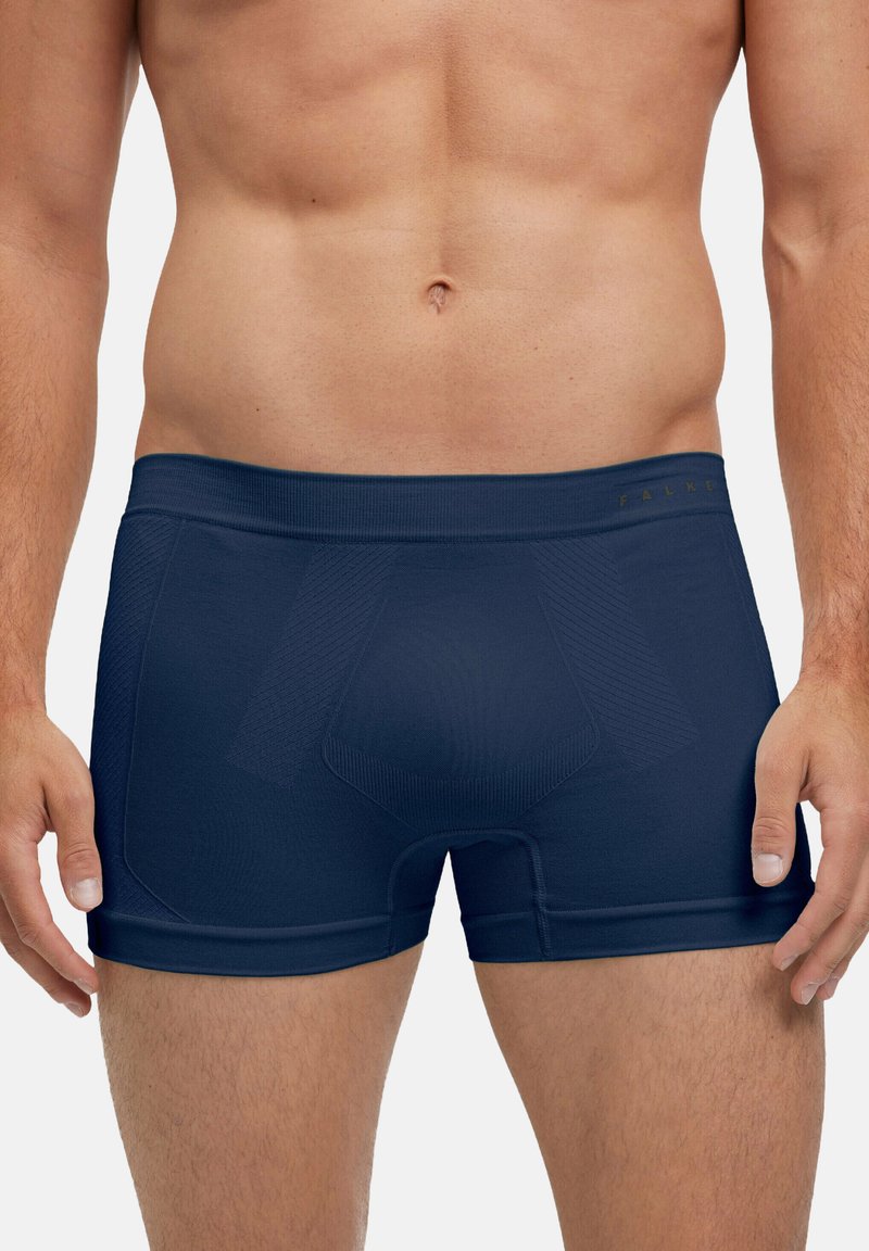 Boxer briefs bleu marine en tissu extensible, présentant une coupe ajustée avec des accents de panneaux texturés et une ceinture élastique.