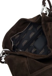 Brown suede handbag with silver hardware, featuring a zippered interior pocket and a patterned lining displaying the brand name "Venezia."