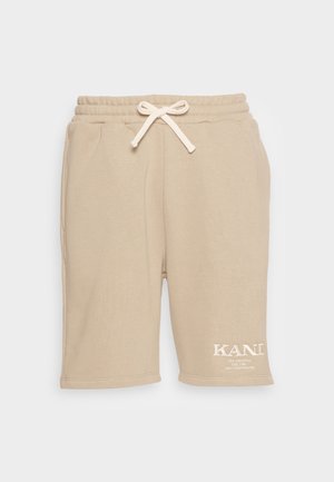 Beige Baumwollshorts mit elastischem Bund, Kordelzug und weiß gesticktem Logo am Bein. Verfügt über Seitentaschen und einen lässigen Schnitt.