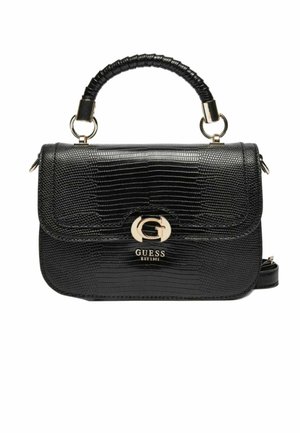 Sac à main noir en cuir synthétique effet crocodile avec poignée supérieure, fermoir doré en forme de "G" et logo Guess embossé sous le rabat.