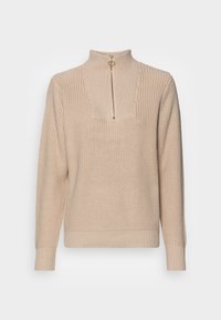 Beige gebreide trui met een hoge kraag en een halve rits. Heeft een geribbelde textuur en lange mouwen, met een subtiel geschulpte rand bij de halslijn.