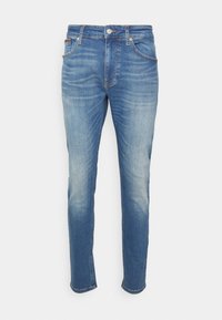 Klasické modré džíny z denimu s rovnou siluetou, se světlejšími detaily, pěti kapsami a knoflíkovým zapínáním. Měkká textilie s pevným prošíváním.