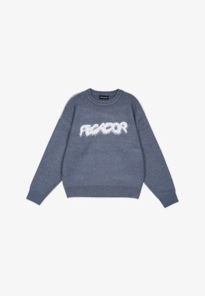 Sininen neulepusero, jossa on pörröinen valkoinen "REACTOR"-logo, pyöreä pääntie, pörröiset hihansuut ja helma. Ominaisuuksiin kuuluu teksturoitu kangas ja kontrastivärinen ompelu.