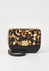 Leopard-print faux fur pouch with black leather bottom, gold-tone chain strap, rectangular shape, and metal clasp detail.
