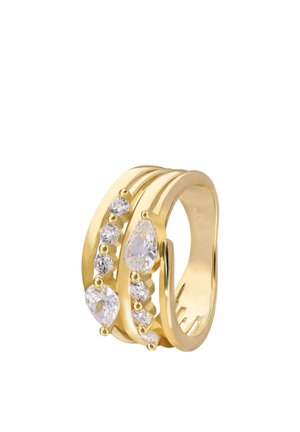 Gold ring with three bands featuring pear-shaped and round clear gemstones in a staggered arrangement.