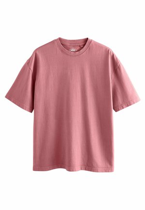 T-shirt à manches courtes en coton rose doux, avec un col rond et une coupe décontractée, doté d'un ourlet droit sans motifs ni accents visibles.