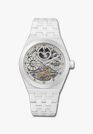 Witte automatische horloge met een transparante mechanische wijzerplaat, met zilveren tandwielen en accenten, een gestructureerde witte band en een ronde kast.