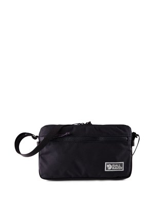 Black Fjällräven crossbody pouch with front zipper pocket and adjustable strap on white background.