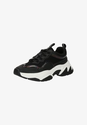 Black sneakers with mesh upper, white accent sole, thick rubber outsole, and reflective detailing along the sides. Unique, chunky design.