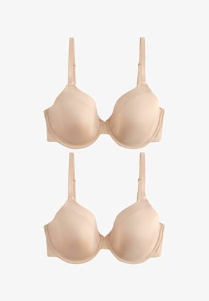 Dvě identické béžové podprsenky s kosticemi a nastavitelnými ramínky, hladké tvarované košíčky, zobrazené na plocho na bílém pozadí.