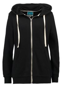 Felpa nera con zip, cappuccio con coulisse, dettagli in corda color crema e tasche frontali. Tessuto morbido con polsini e bordi a costine.