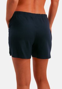 Marineblauwe katoenen shorts met een elastische tailleband en zijzakken, met een gladde textuur en een comfortabele pasvorm.